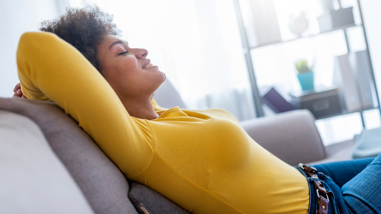 Woman reclining on sofa 