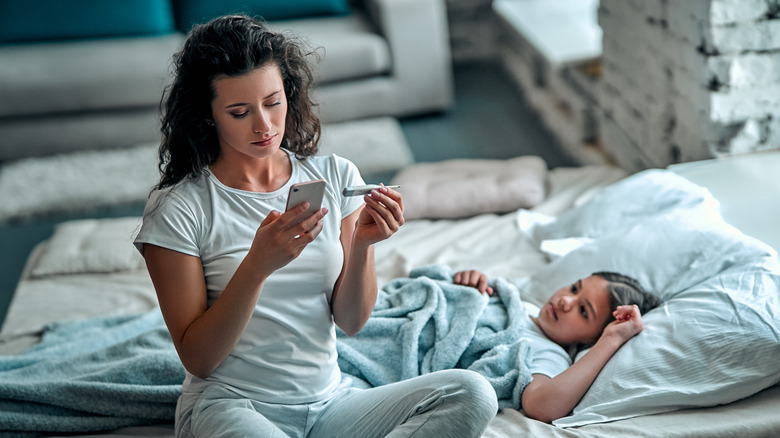 Mother caring for sick child