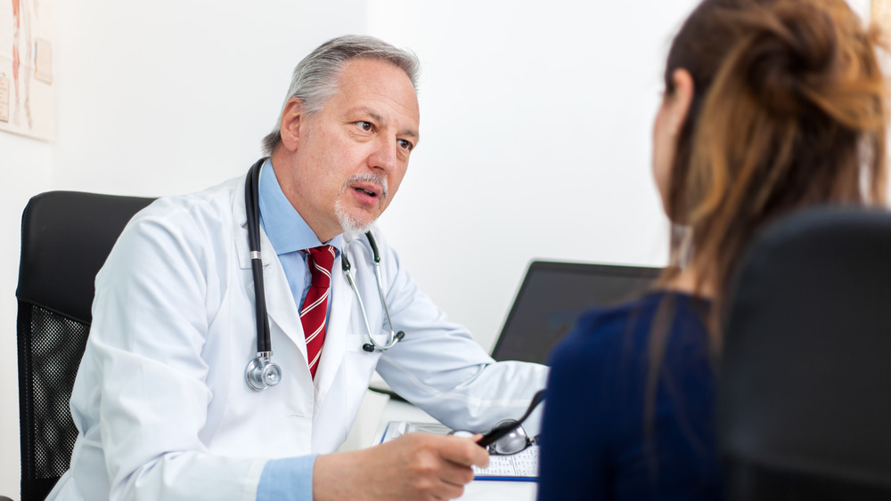 Woman talking to a doctor