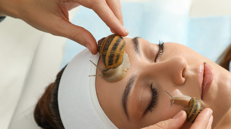 Woman receiving snail mucus treatment