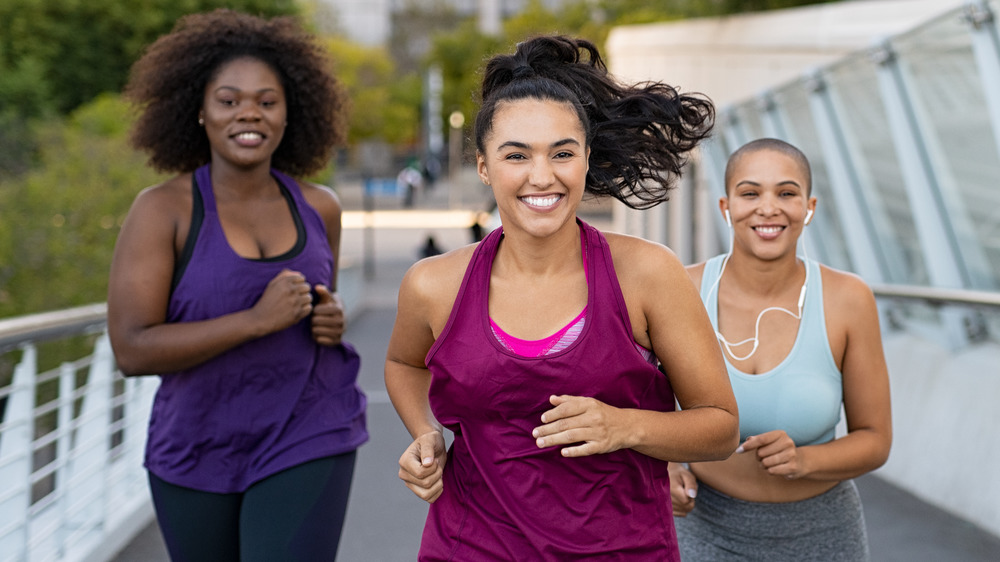 three women running outside