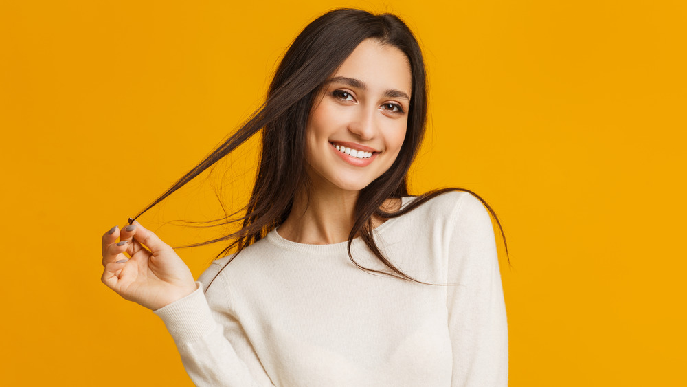 Woman touching hair