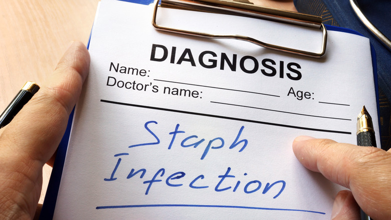 'Staph infection' written on a medical clipboard