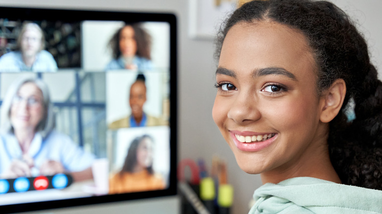 young woman with faces from a zoom call