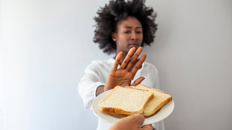 young black woman refusing bread 