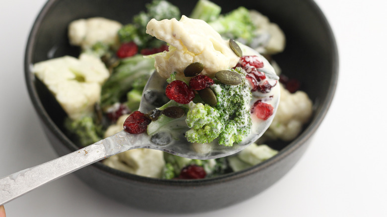 serving broccoli and cauliflower salad