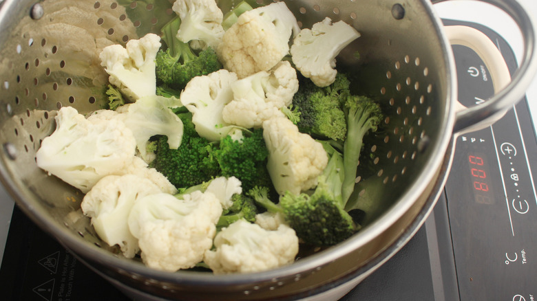 steaming broccoli and cauliflower pieces