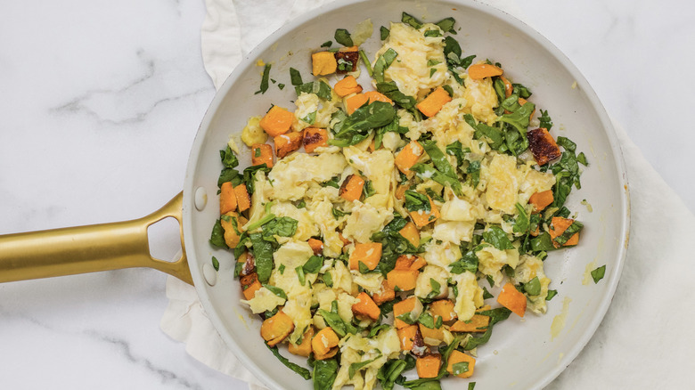 Cheese on top of butternut squash scrambled egg