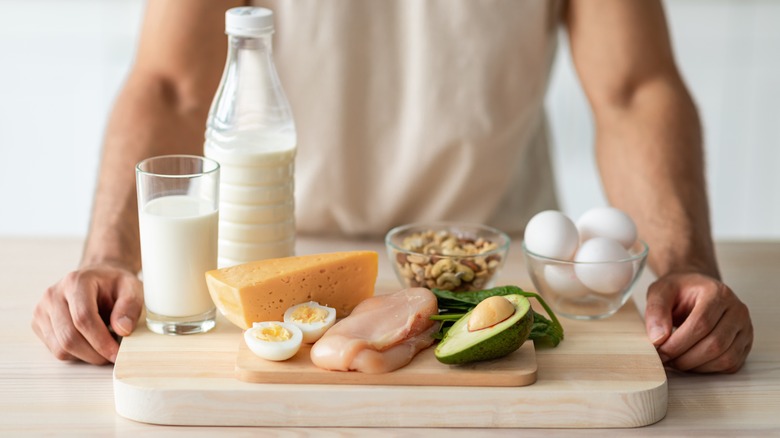 wood board filled with protein foods