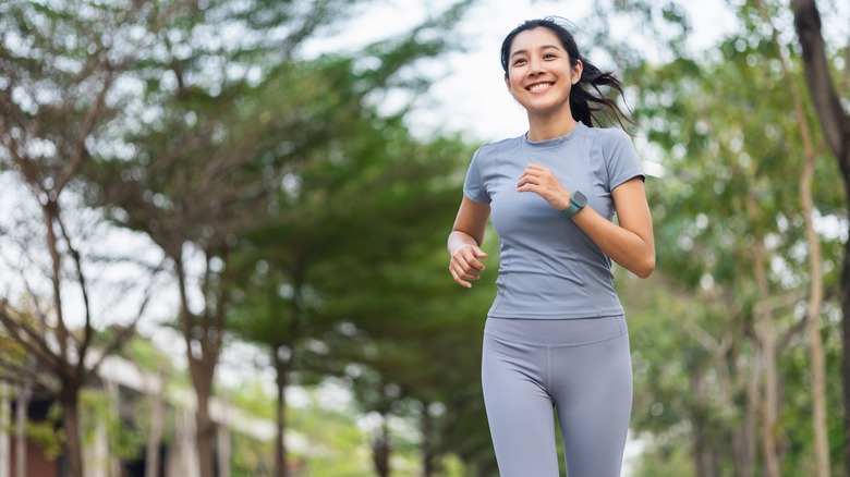 woman wearing sportswear jogging