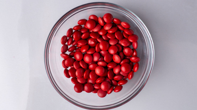 Glass bowl of red candy