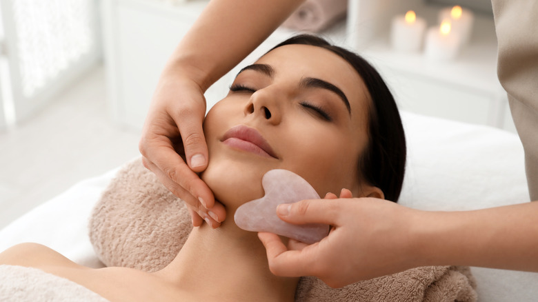 woman receiving gua sha massage