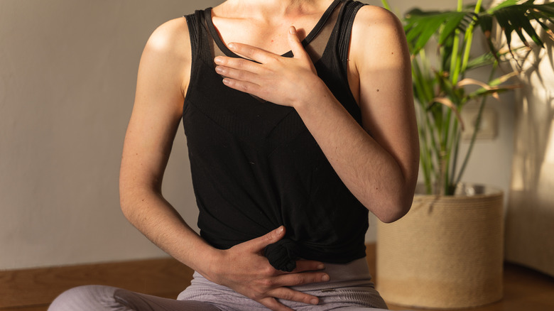 woman practicing diaphragmatic breathing