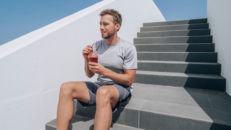 Man drinking beet juice