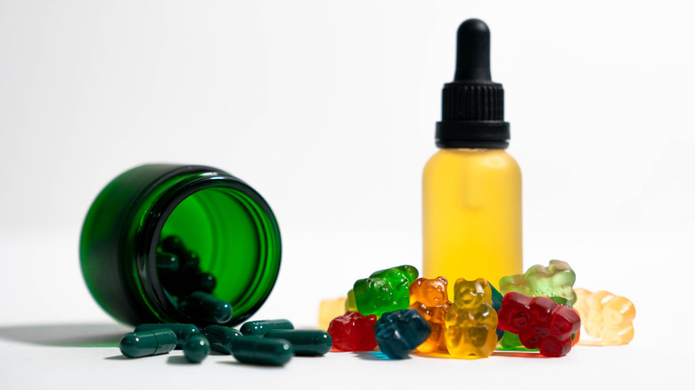 CBD supplements including oil, pills, and gummy bears