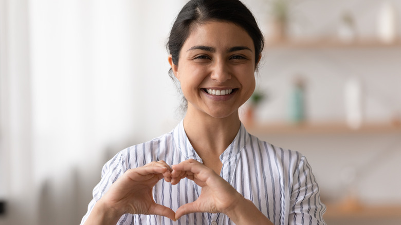 Woman making the heart sign with her hands