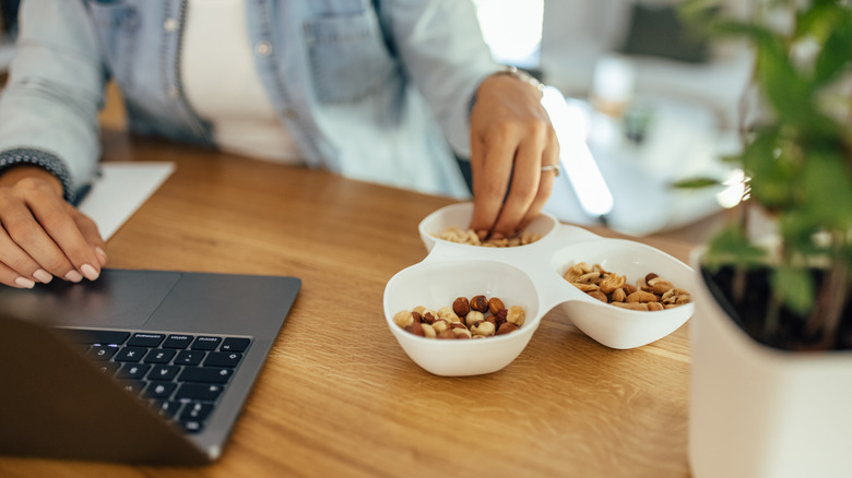 Person eating nuts