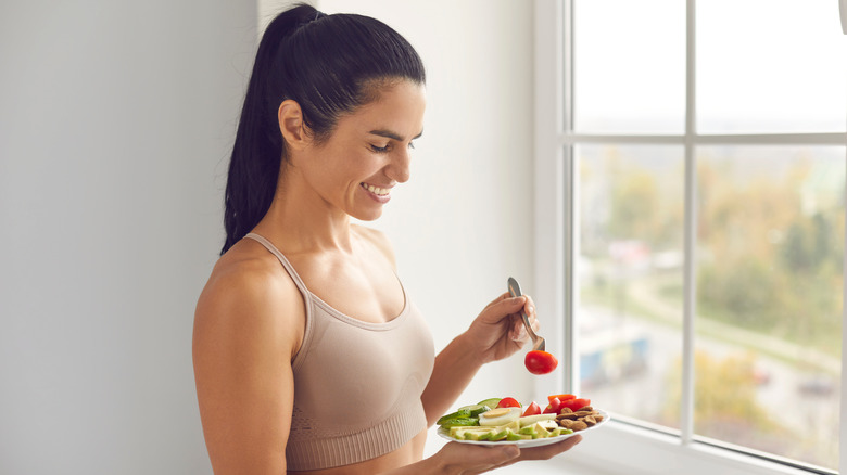 Fit woman eating a balanced meal