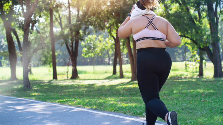 a woman running outdoors