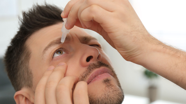 Man using artificial tears