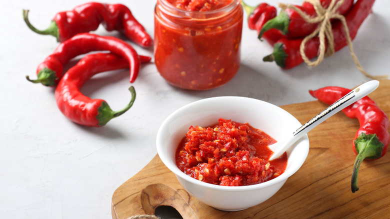 peppers and jar of hot sauce