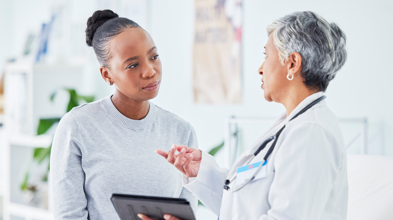 woman speaking with her doctor about ibuprofen