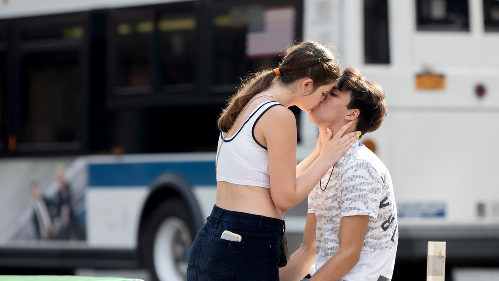 Couple kissing on street