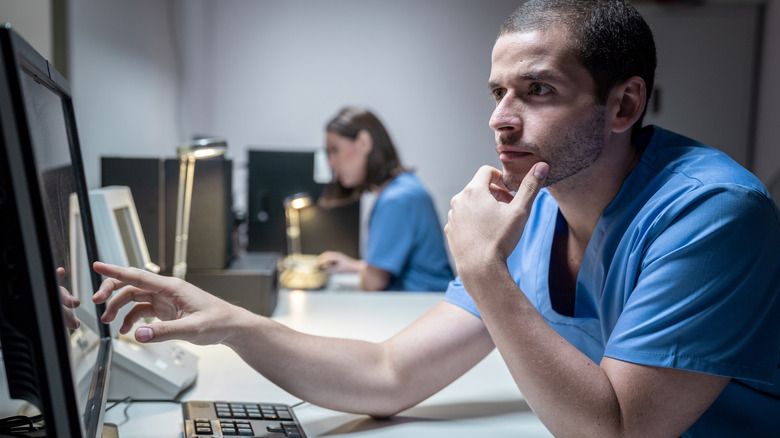 lab technician looking at computer