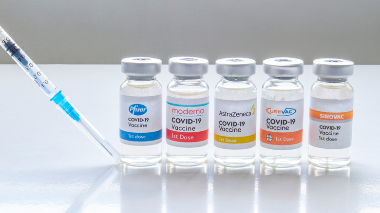 Several vials of the COVID-19 vaccine sit on a table