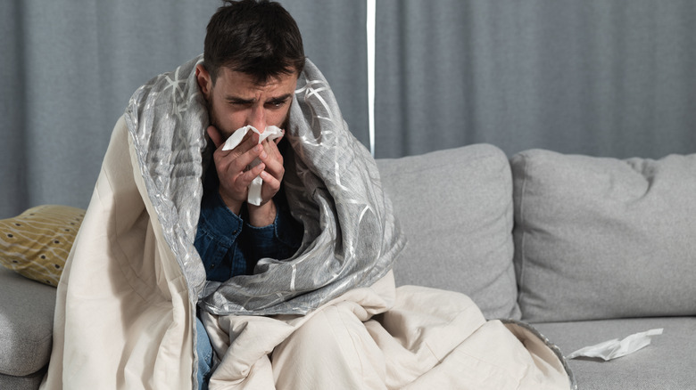 sick man under blanket