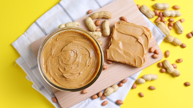 peanut butter jar and peanut butter on bread