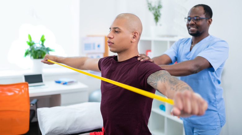 physical therapy patient using arm band