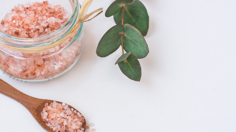 Open jar of pink Himalayan salt