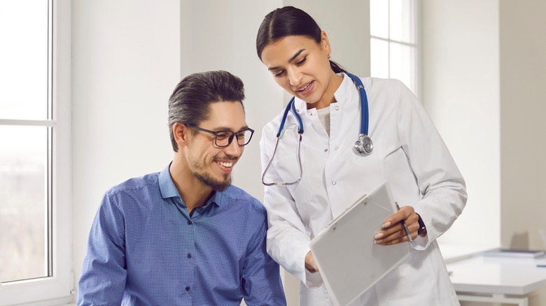 healthy man meeting with a doctor