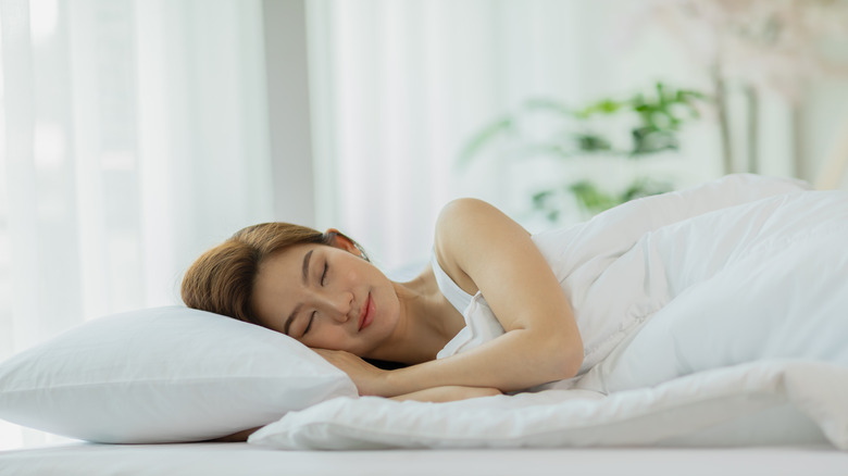 Woman sleeping peacefully in bed