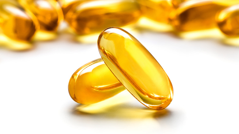 close-up of two fish oil capsules