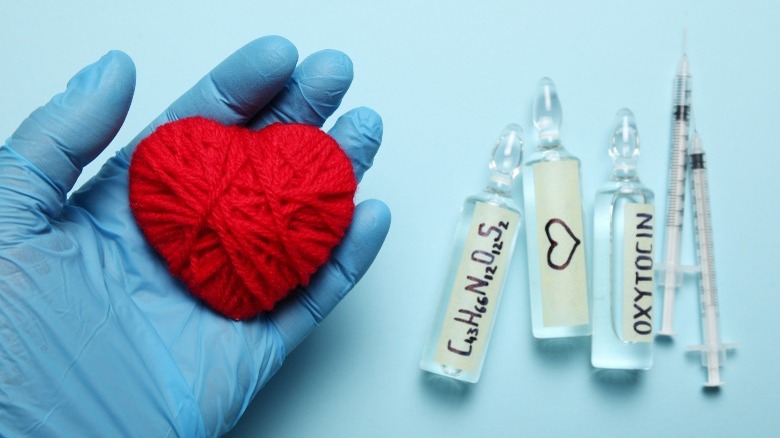 wool knit heart and syringes with oxytocin 