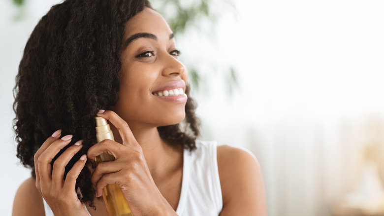 black woman cares for natural hair 