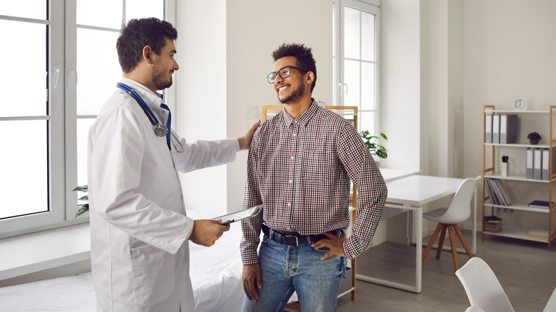 Man speaking with his doctor