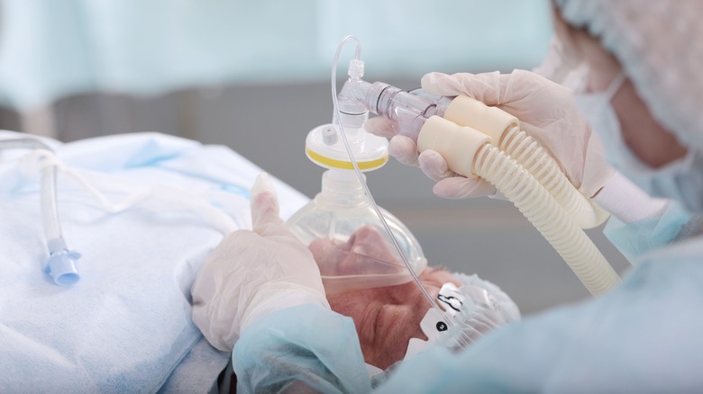 Elderly man receiving anesthesia