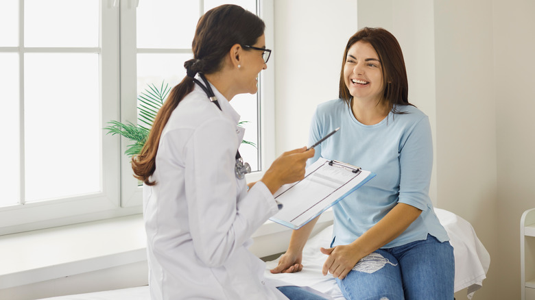 Woman talking to doctor 