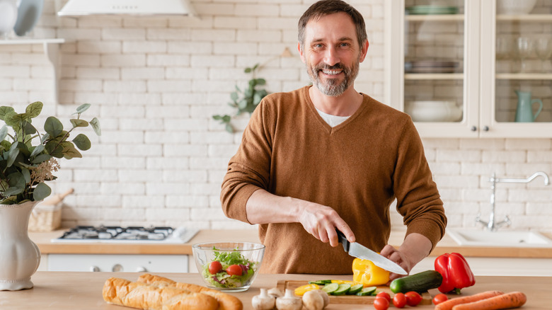 Man in kitchen with vegetables