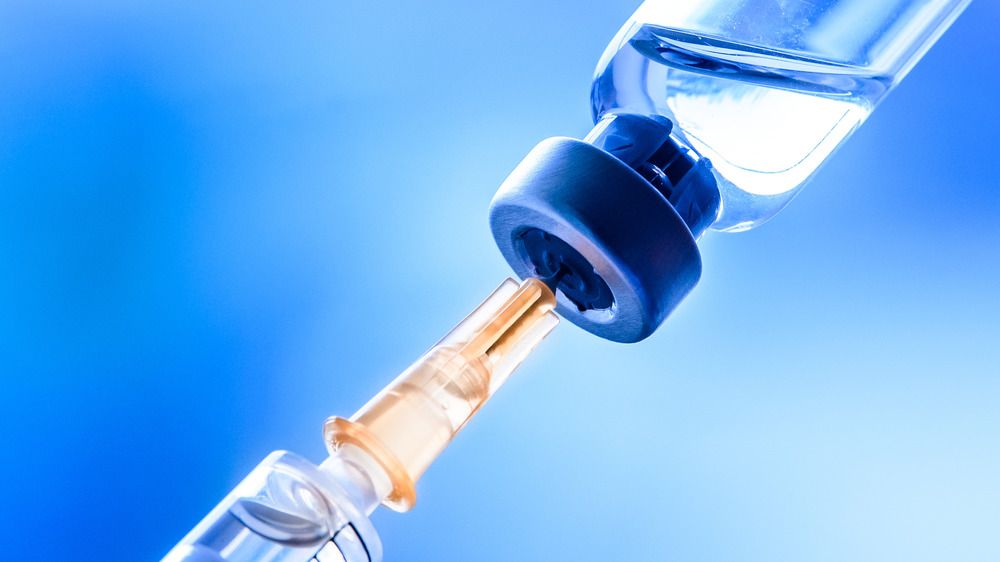 a vaccination needle and fluid 