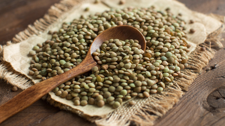 Lentils and wooden spoon