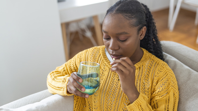 Woman taking pill