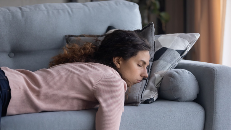 Woman sleeping on couch