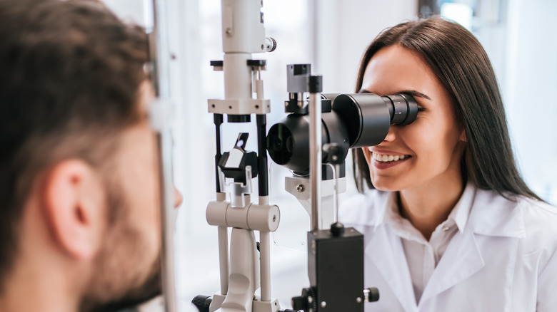 Eye doctor giving a patient an exam