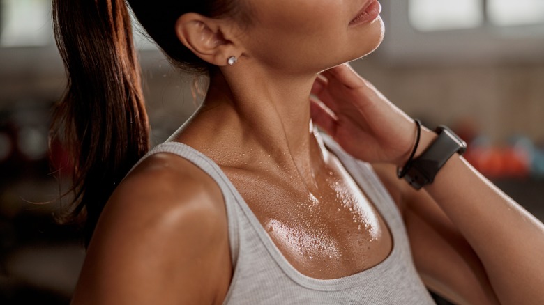 Woman sweating during workout