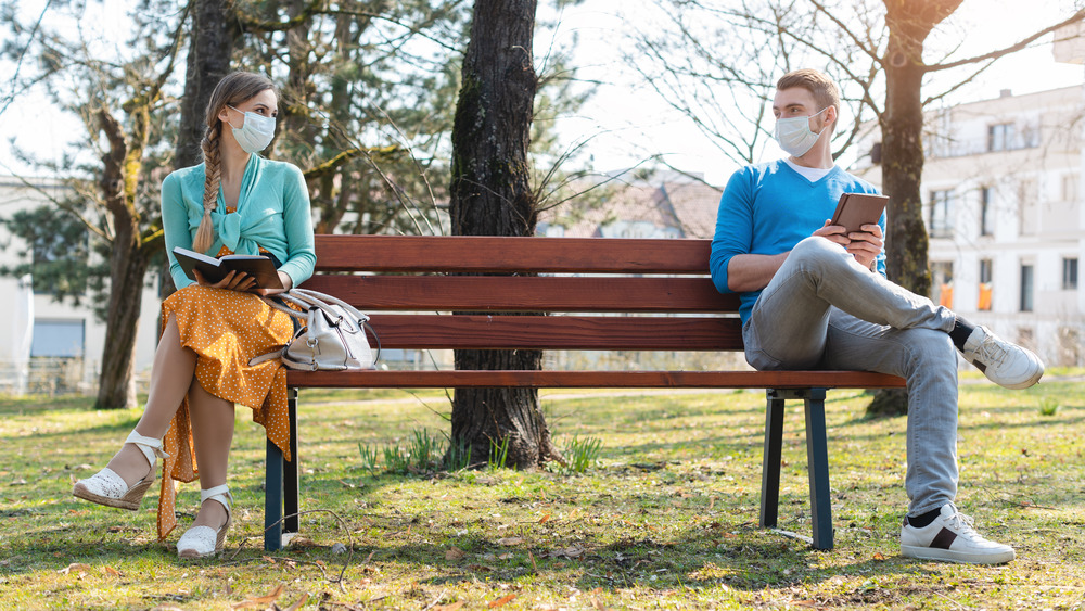 Woman and man sitting on a bench