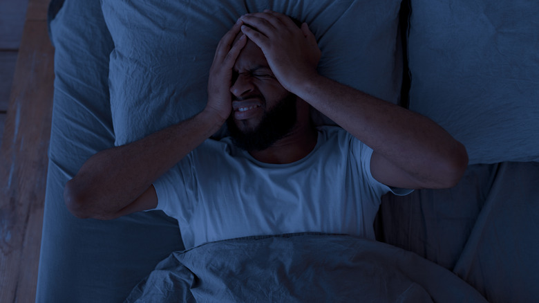Man experiencing insomnia at night